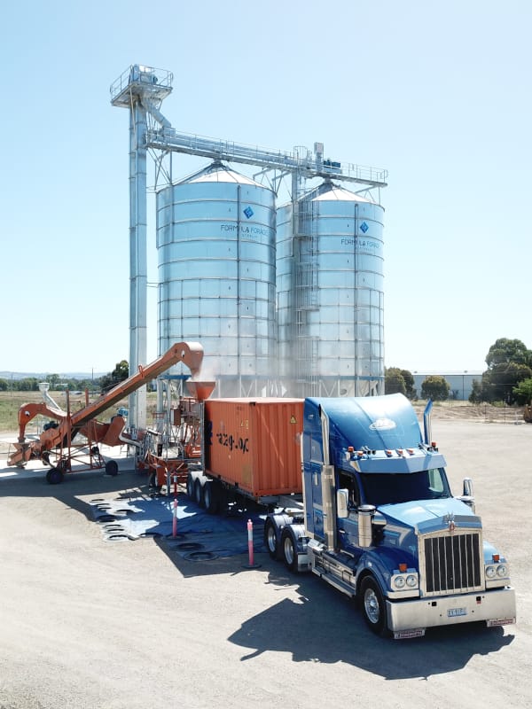 Packing grain into shipping container